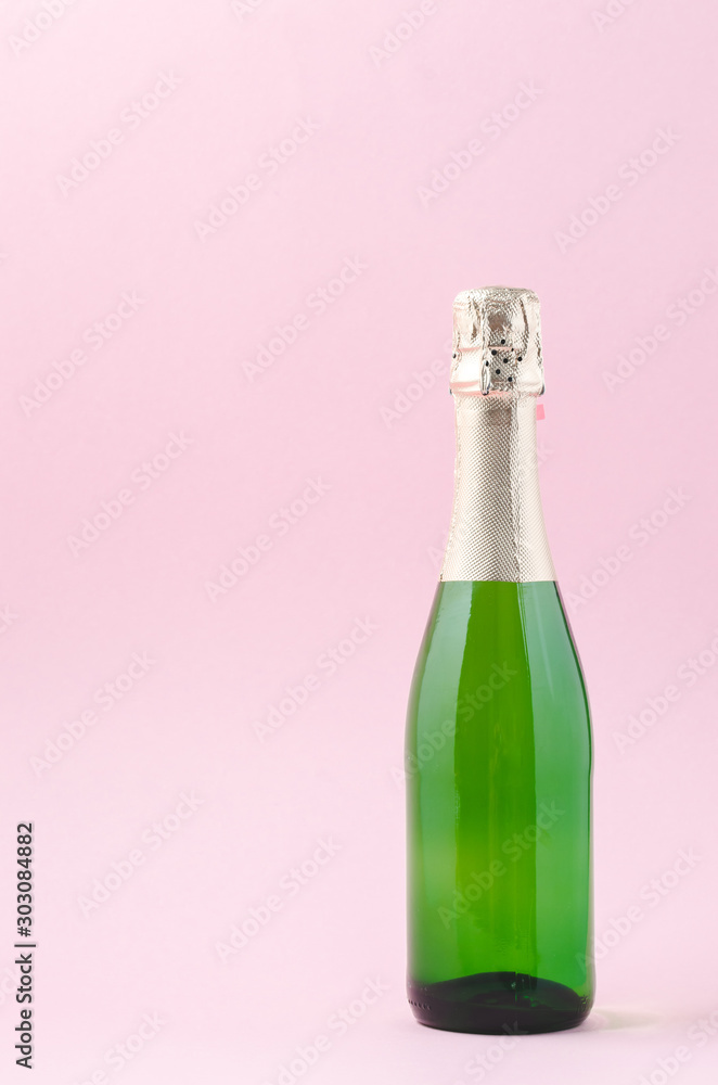 Champagne glasses and bottle on pink background, space for text. Christmas decoration Champagne glasses and bottle on pink background, space for text. Christmas decoration