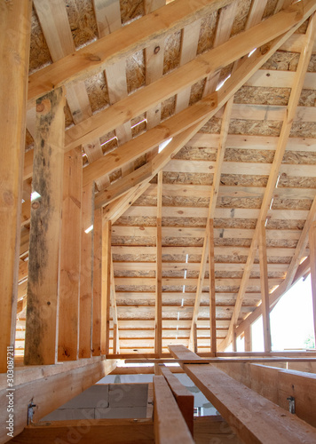 Wooden roof at a cottage construction site