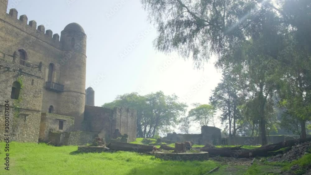 Camera pan left to reveal southern exterior facade of Fasilides Castle tower within the Fasil Ghebbi royal enclosure complex in Gondar, Ethiopia Camera pan left to reveal southern exterior facade of Fasilides Castle tower within the Fasil Ghebbi royal enclosure complex in Gondar, Ethiopia