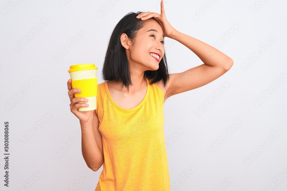 Young chinese woman drinking take away glass of coffee over isolated white background stressed with hand on head, shocked with shame and surprise face, angry and frustrated. Fear and upset for mistake Young chinese woman drinking take away glass of coffee over isolated white background stressed with hand on head, shocked with shame and surprise face, angry and frustrated. Fear and upset for mistake