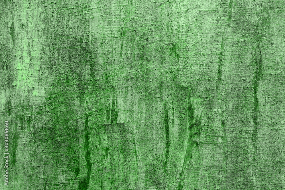 Fototapeta premium green dirty stucco with damaged paint texture - cute abstract photo background