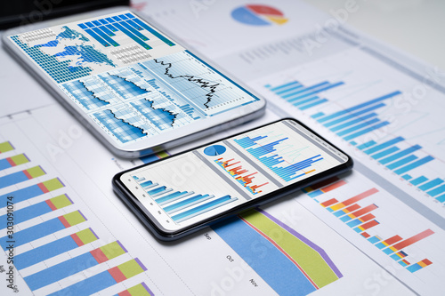 Mobilephones With Business Charts photo