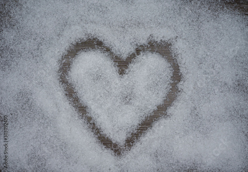 a heart in the snow at winter time