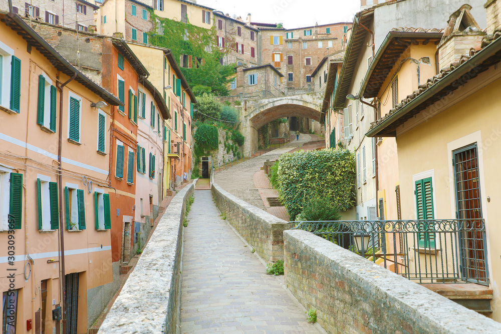 Perugia, Italy. Old medieval aqueduct and colorful buildings.