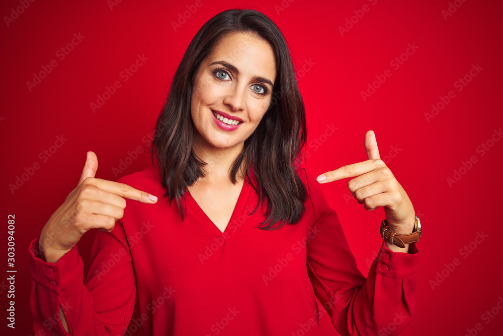Young beautiful woman wearing shirt standing over red isolated background looking confident with smile on face, pointing oneself with fingers proud and happy. Young beautiful woman wearing shirt standing over red isolated background looking confident with smile on face, pointing oneself with fingers proud and happy.