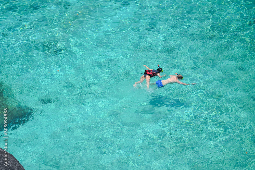 Aerial view couple snorkeling in the sea