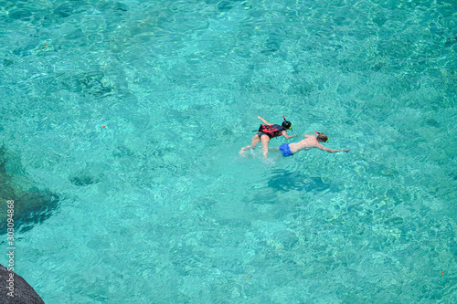 Aerial view couple snorkeling in the sea