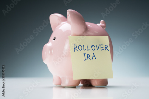 Rollover Ira Text On Note With Piggy Bank photo