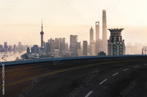 Asphalt road and urban building of Shanghai, driveway and road. © Vink Fan