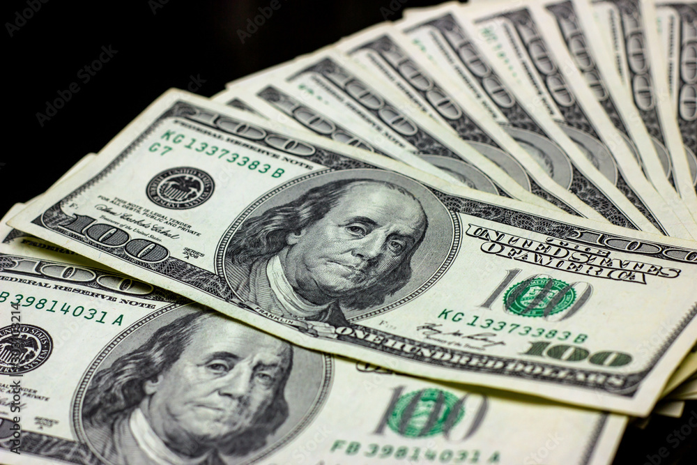 Hundred dollars usa on black background. Finance and money concept. Hundred dollars usa on black background. Finance and money concept.