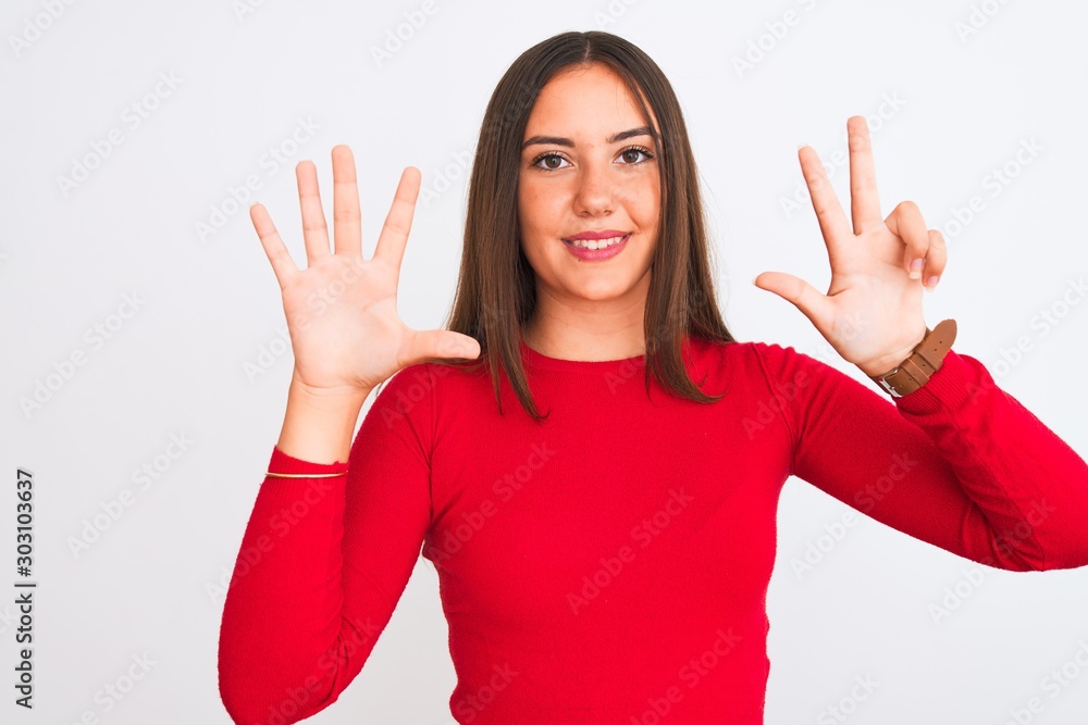 Young beautiful girl wearing red casual t-shirt standing over isolated white background showing and pointing up with fingers number eight while smiling confident and happy. Young beautiful girl wearing red casual t-shirt standing over isolated white background showing and pointing up with fingers number eight while smiling confident and happy.