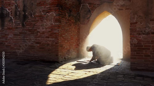 Muslim man praying at an old mosque in Phra Nakhon Si Ayutthaya Province, Thailand, Asian Muslims photo