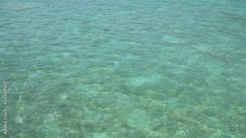 Crystal clear turquoise blue sea background at Rawai Beach, Phuket, Thailand Crystal clear turquoise blue sea background at Rawai Beach, Phuket, Thailand