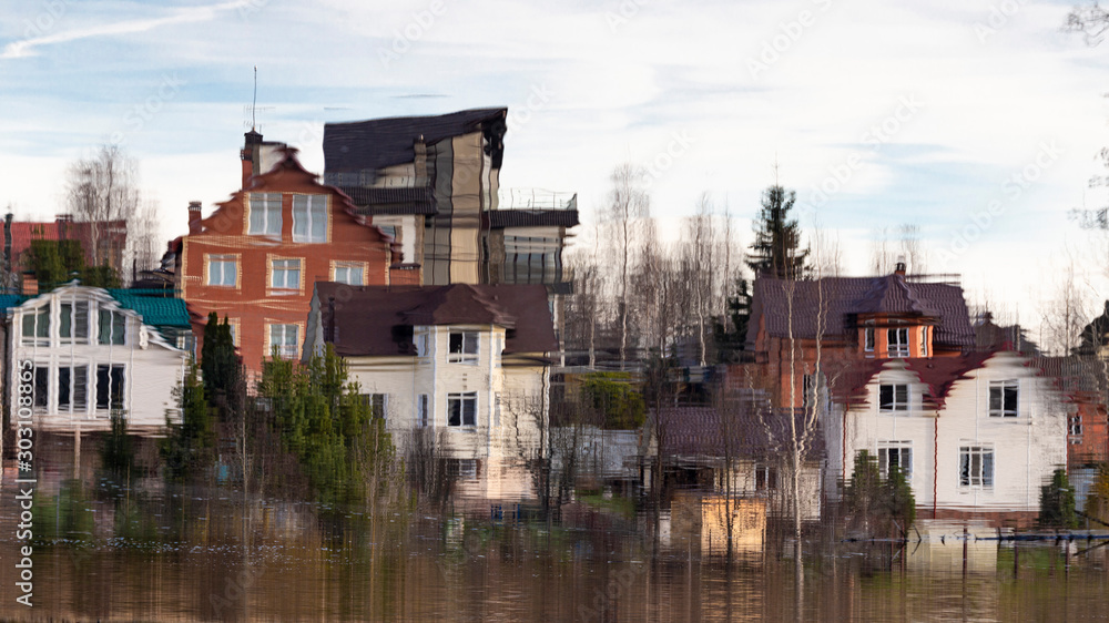 Reflection of cottages in the water