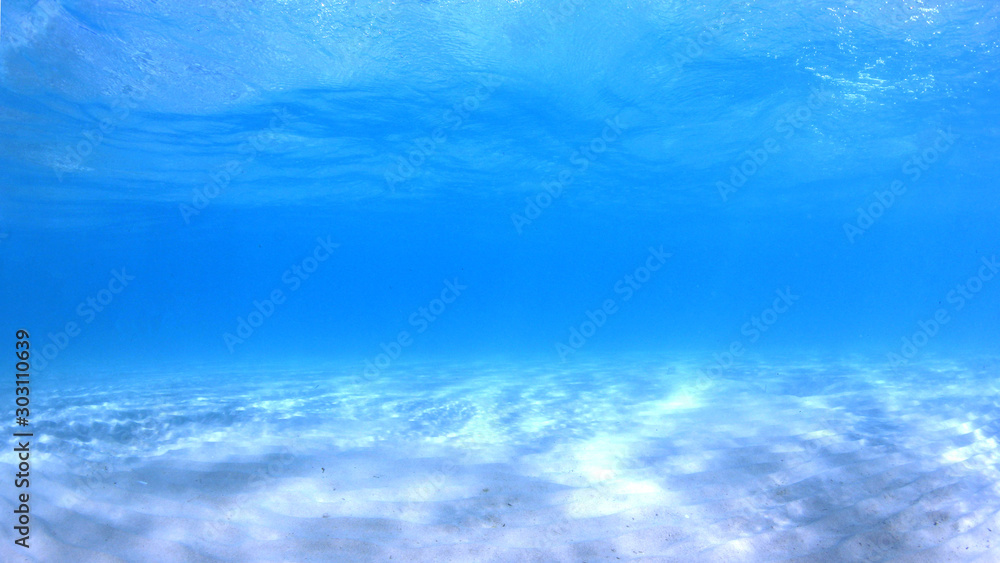 Underwater photo of blue water background in ocean Underwater photo of blue water background in ocean