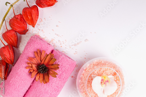 Pink spa prodacts on white background. Copy space, flat lay photo