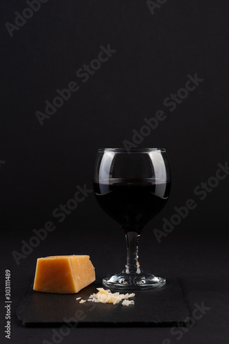 a glass of red wine with  parmesan cheese