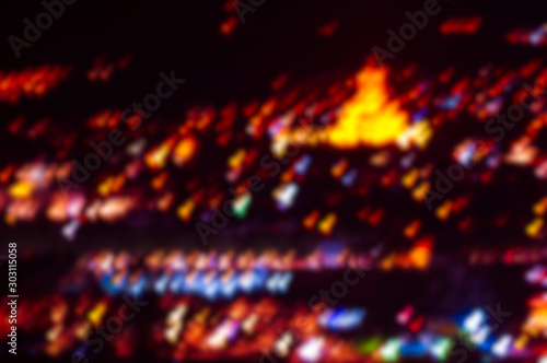 blurred background of multicolored lights of the night city © Sergey