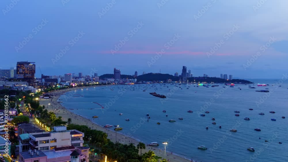 Time Lapse: Pattaya bay beach bay and city, day to night, Chonburi, Thailand; tilt down Time Lapse: Pattaya bay beach bay and city, day to night, Chonburi, Thailand; tilt down