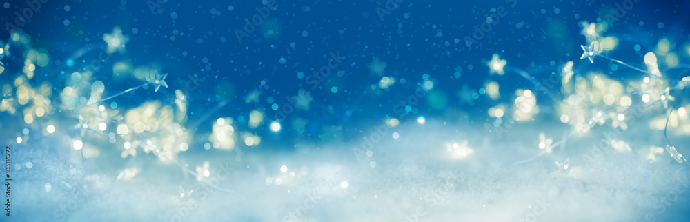 Abstract winter background with bokeh and stars  -  New year  -  Christmas backdrop  -  Xmas card with copy space