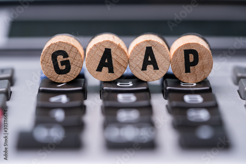 Foto Gaap Letters On Wooden Blocks Over Calculator