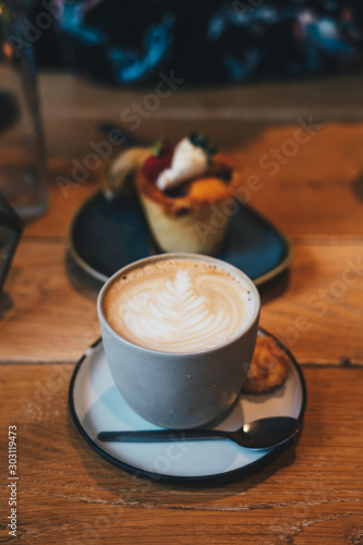 Photography Latte Cafee with cupcake in the background