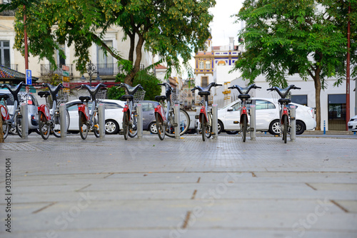 Seville, Spain - November 5, 2019: Bicycle rental stand in Seville.