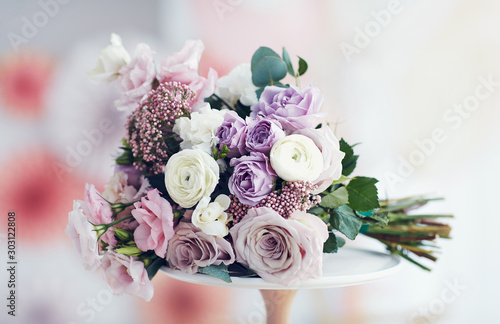 beautiful delicate flower bouquet with roses, ranunculuses, eustomas and carnati Fototapeta