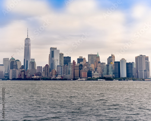 Cityscape of the financial district of Manhattan from Liberty Island, in a sunny day.