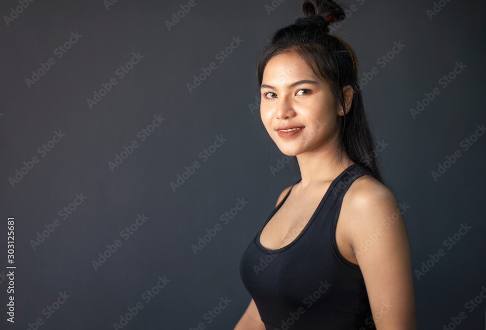 Portrait of young beautiful woman with healthy skin on dark background Portrait of young beautiful woman with healthy skin on dark background