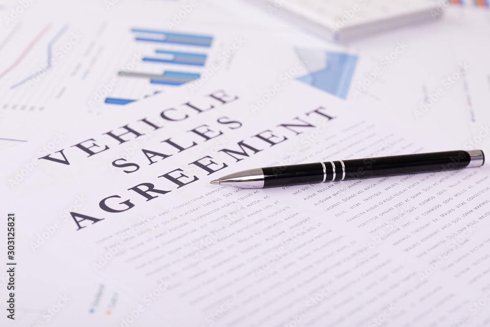 vehicle sales agreement concept, documents on the desktop vehicle sales agreement concept, documents on the desktop