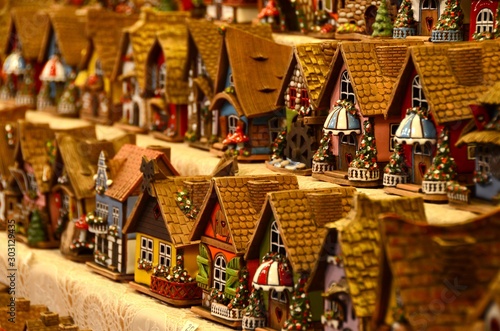Christmas Ornaments in a Christmas Market. colored little houses in a market. Xmas time in Italy.
