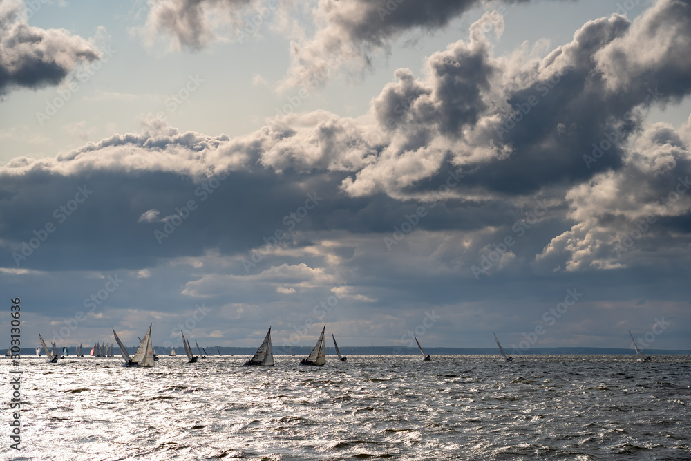 Big sailing race under clouds sky Big sailing race under clouds sky