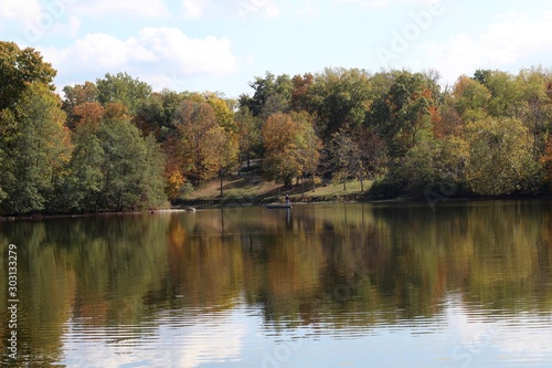A view of the calm lake on a sunny autumn day.