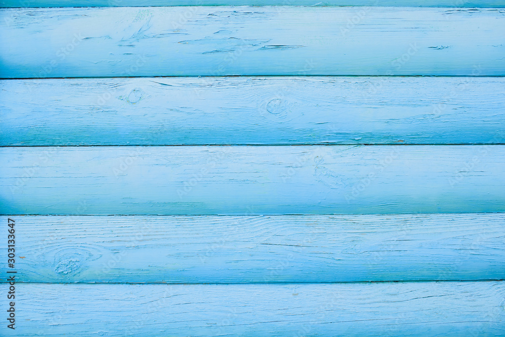 The wooden wall is blue. Background. Texture.