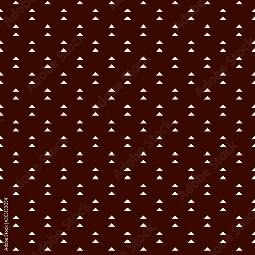 Repeated mini triangles on white background. Simple abstract wallpaper. Seamless pattern design with geometric figures.