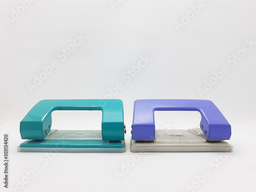 Handheld Colorful Metallic Mechanical Paper Hole Puncher for Office and Home Supplies Appliances in White Isolated Background