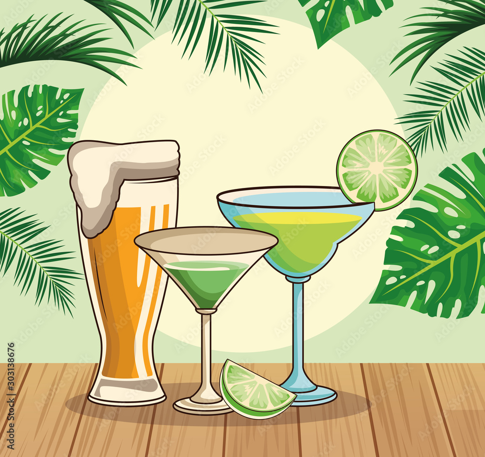 beer glass and tropical cocktails over tropical leaves and retro style background