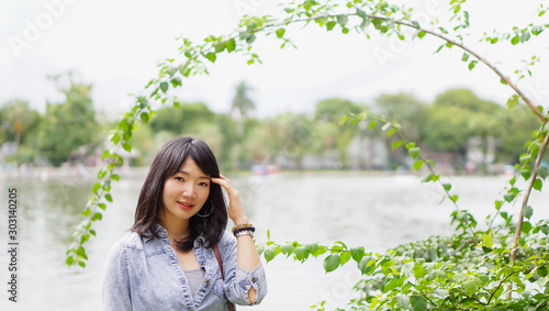 Photography Thai woman wearing a T-shirt and jeans