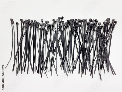 Plastic Black Ties Wire Cable for Effectively Fasten Mechanical Industrial Computer Electronic used in White Isolated Background 