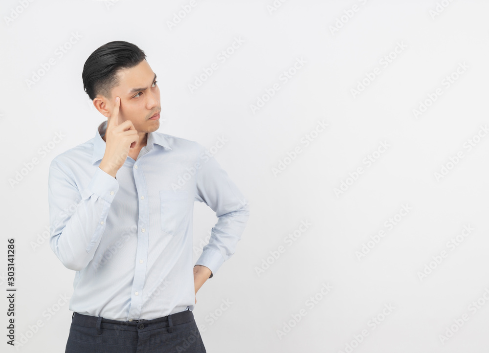 Young handsome asian business man thinking an idea while looking up isolated on white background. Young handsome asian business man thinking an idea while looking up isolated on white background.