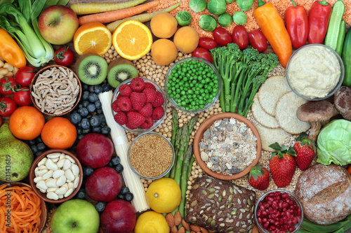 Fotografie Low glycemic health food for weight loss & fitness concept with foods high in vitamins, minerals, antioxidants, smart carbs, omega 3 & protein