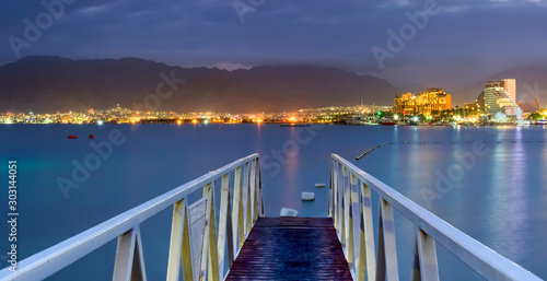 Night  panoramic view on the central public beach of Eilat - famous tourist r...