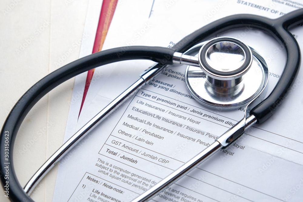 Stethoscope with Pen, Charts and Graphs, Finance, Account, Statistics, Investment, Analytic Research Data, Medical and Insurances Concept Stethoscope with Pen, Charts and Graphs, Finance, Account, Statistics, Investment, Analytic Research Data, Medical and Insurances Concept
