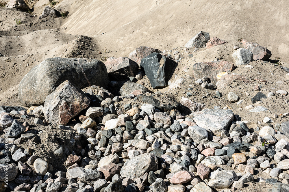 Close up of mining quarry for the production of crushed stone, sand and gravel for use in the construction industry Close up of mining quarry for the production of crushed stone, sand and gravel for use in the construction industry