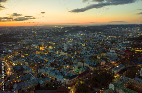 above the roofs on sunset. old european city. Ukraine Lviv