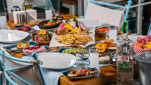 Fotografie Turkish and Greek Traditional Dinning Table with Special Alcohol Drink Raki