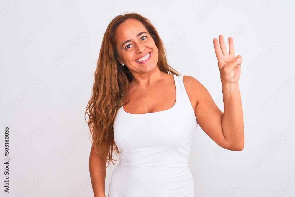 Middle age mature woman standing over white isolated background showing and pointing up with fingers number three while smiling confident and happy. Middle age mature woman standing over white isolated background showing and pointing up with fingers number three while smiling confident and happy.