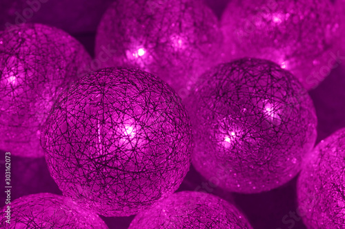 Background from luminous balls of violet color.