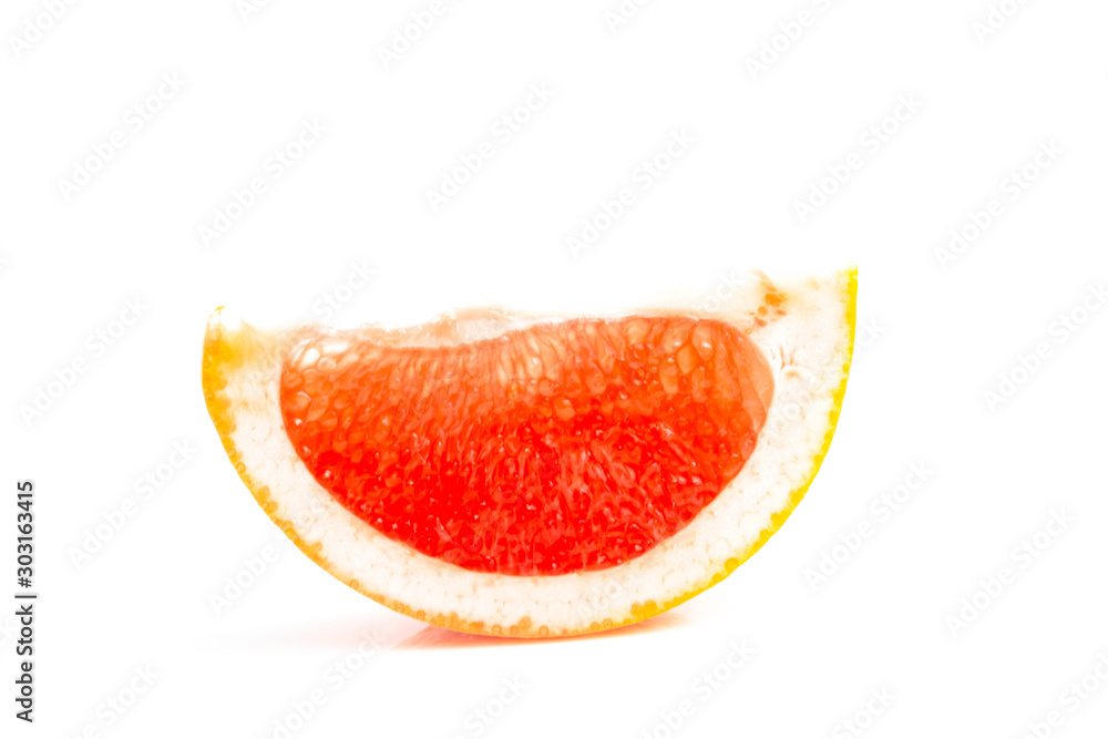 Orange-red grapefruit in a cut on a white background. close up Orange-red grapefruit in a cut on a white background. close up